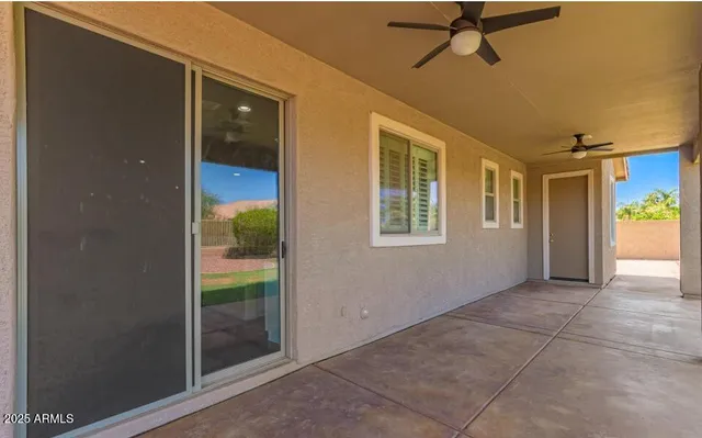 a bathroom with a sink double vanity granite tub shower and a mirror