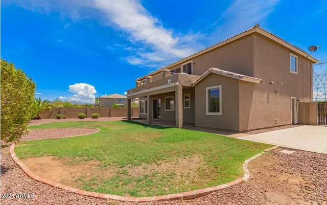 a living room with furniture ceiling fan and a window