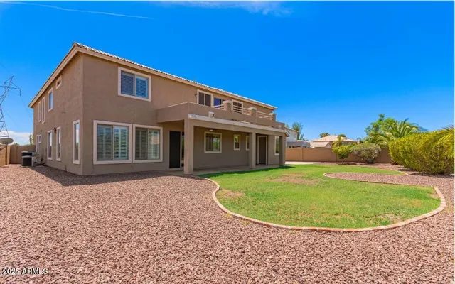 a livingroom with workspace and a window