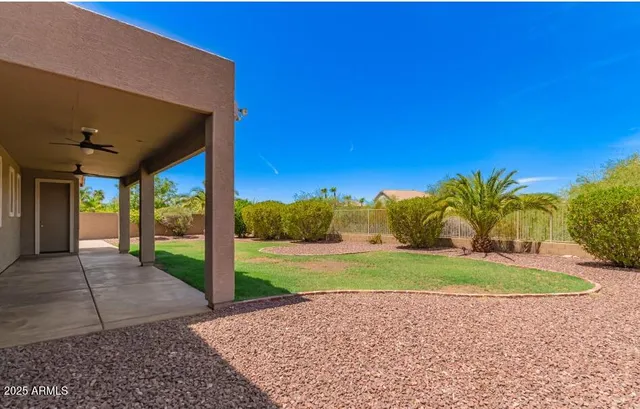 a bathroom with a sink a toilet and shower curtain
