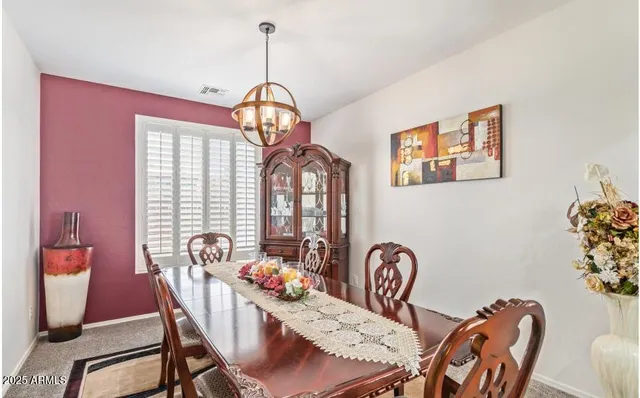 a living room with furniture and a lamp