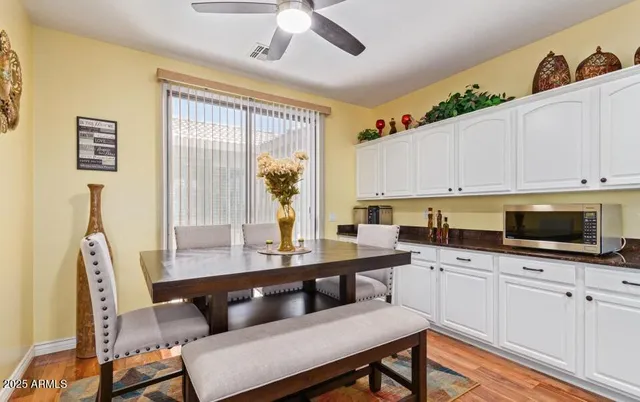 a bathroom with a sink double vanity granite tub shower and a mirror