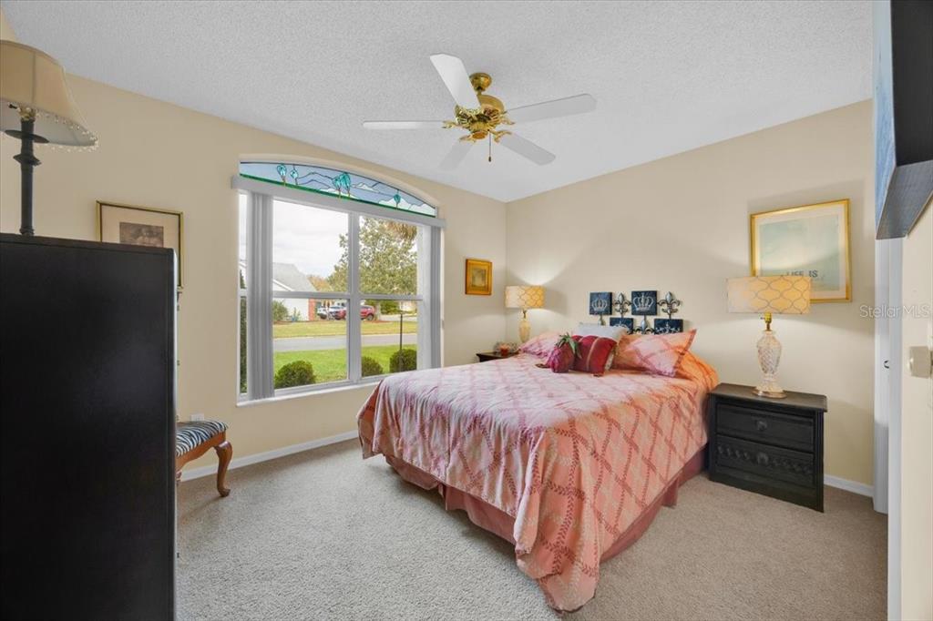 802 Miranda Way The Villages, FL 32159 - Photo 17 of 29 a bed room with a bed and a window