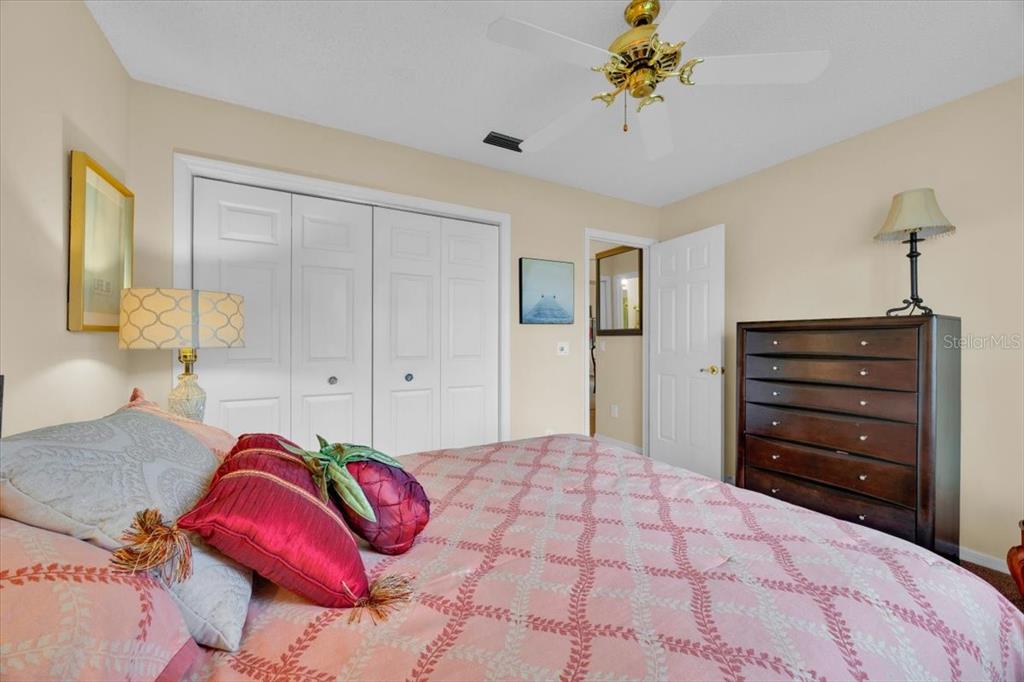 802 Miranda Way The Villages, FL 32159 - Photo 18 of 29 a bedroom with a bed and ceiling fan