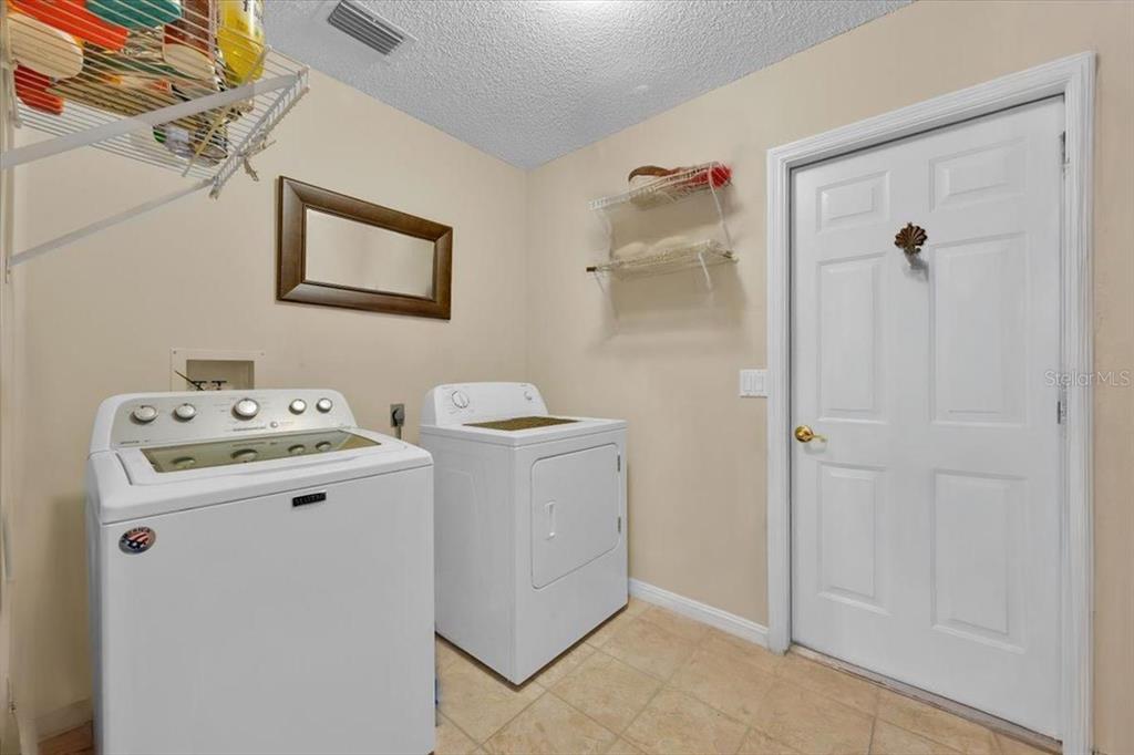 802 Miranda Way The Villages, FL 32159 - Photo 20 of 29 a utility room with dryer and washer