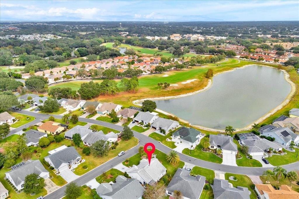 802 Miranda Way The Villages, FL 32159 - Photo 27 of 29 an aerial view of residential houses with outdoor space and ocean view