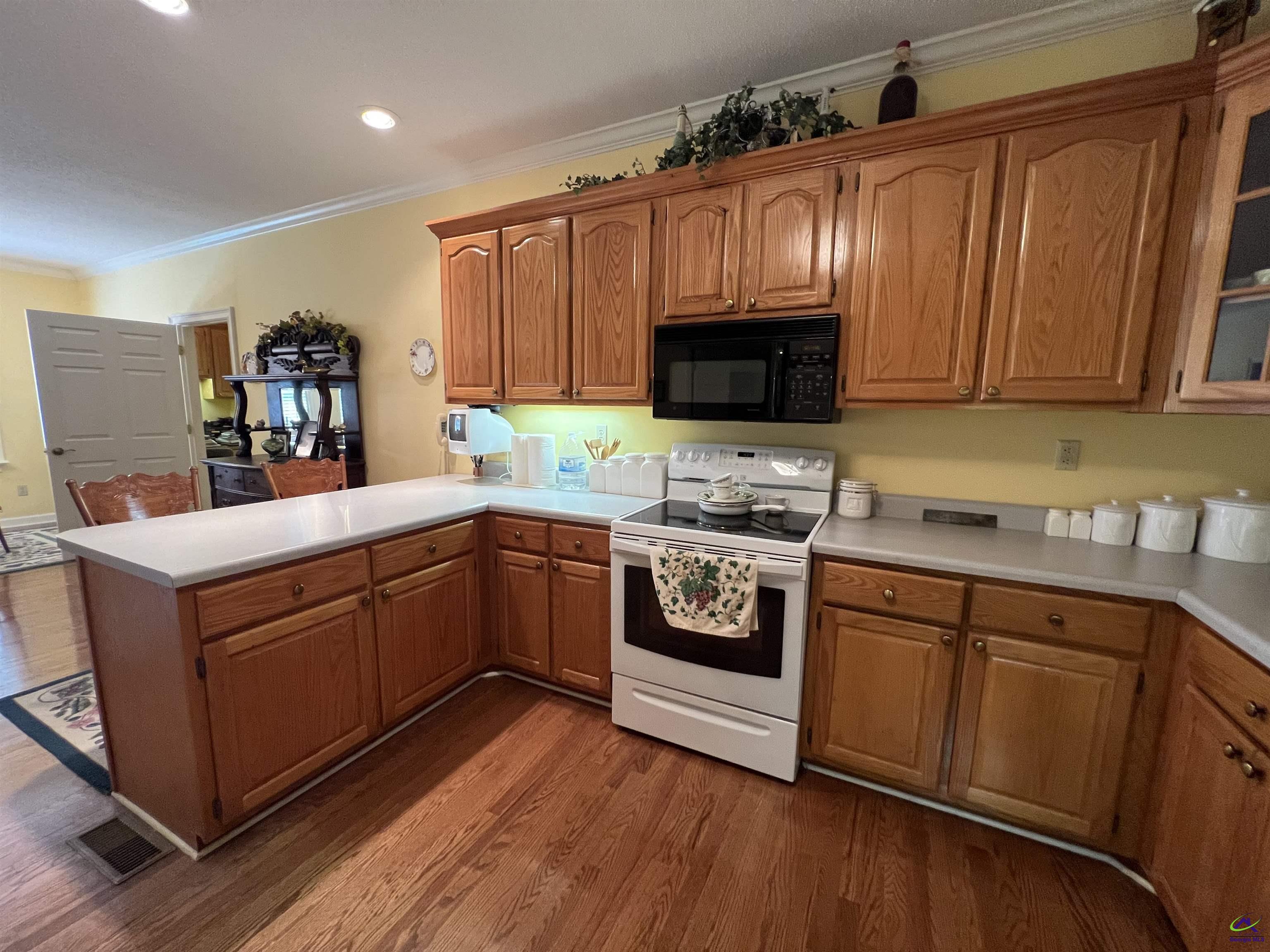 762 Nicholson-Carr Road Chester, GA 31012 - Photo 12 of 81 a kitchen with stainless steel appliances a stove top oven a sink and a microwave