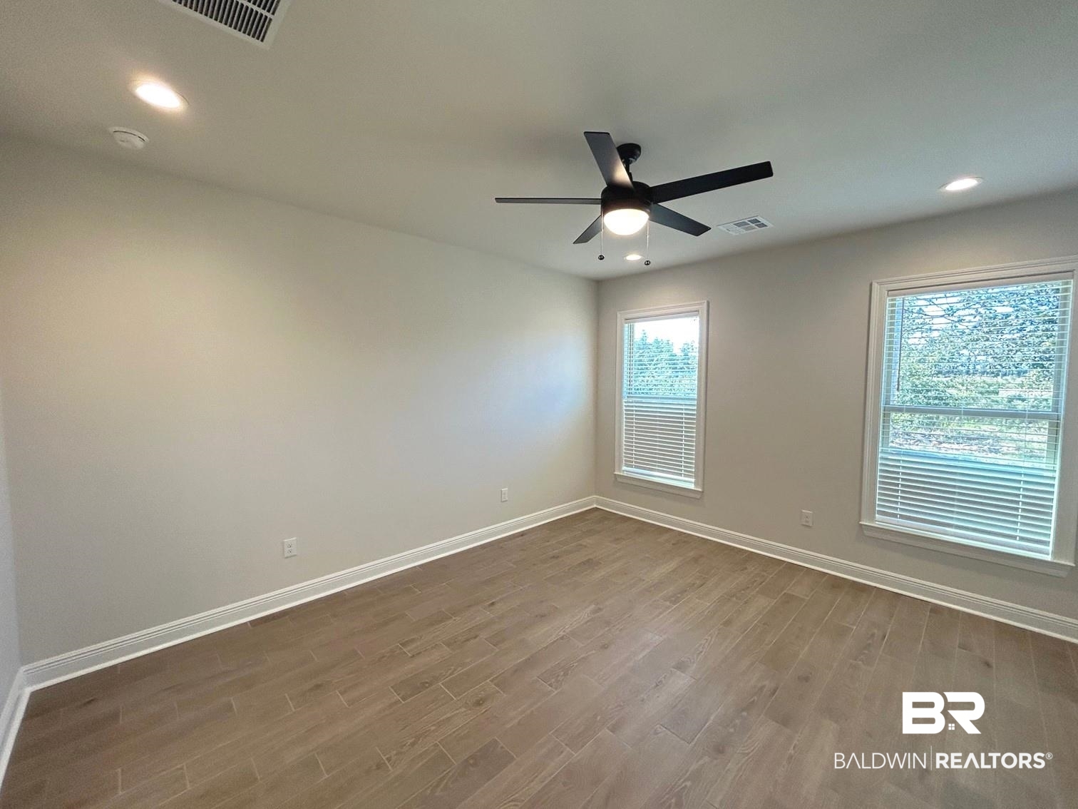 872 Sumter Loop Foley, AL 36535 - Photo 5 of 18 Unfurnished room featuring ceiling fan and hardwood / wood-style flooring