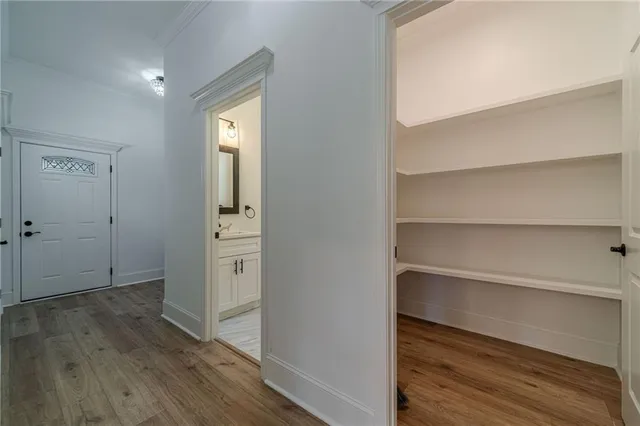 a bathroom with a toilet a sink a vanity and mirror