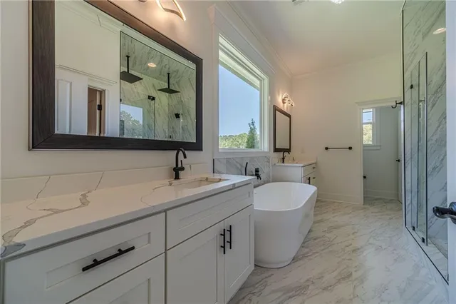 a bathroom with a bathtub and a shower