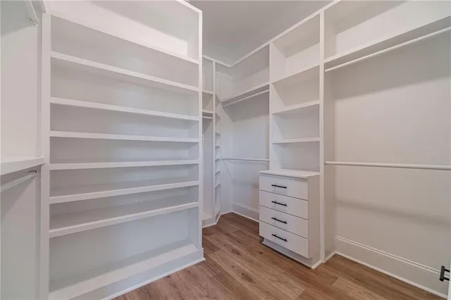 a bathroom with a double vanity sink a mirror and a bathtub