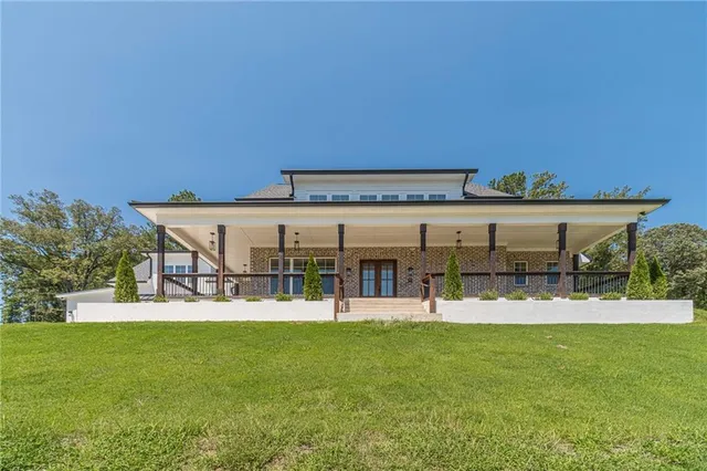 a view of a patio with a yard