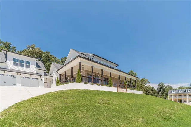 a view of house with yard