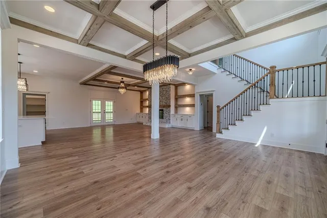 a view of an entryway with wooden floor