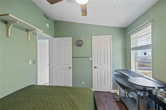 a bedroom with furniture and a window