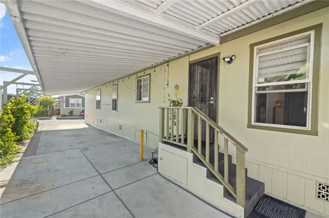 a swimming pool with outdoor seating and yard