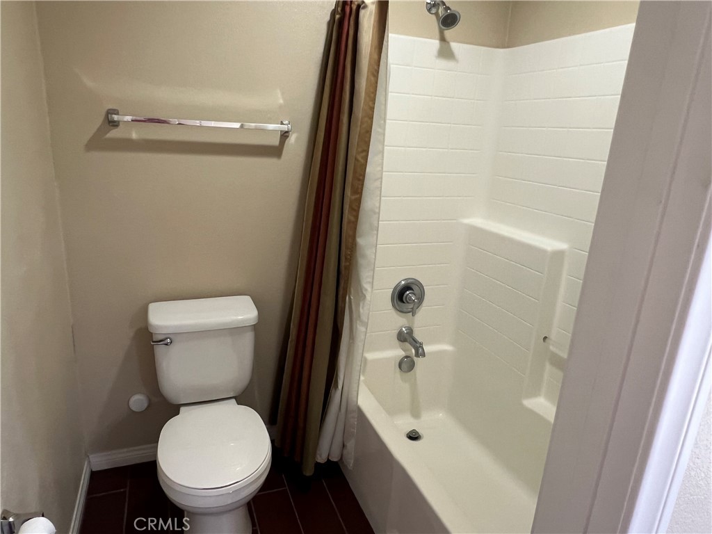 1510 Orange Avenue, Unit 902 Redlands, CA 92373 - Photo 18 of 29 a white toilet sitting next to a bathroom sink