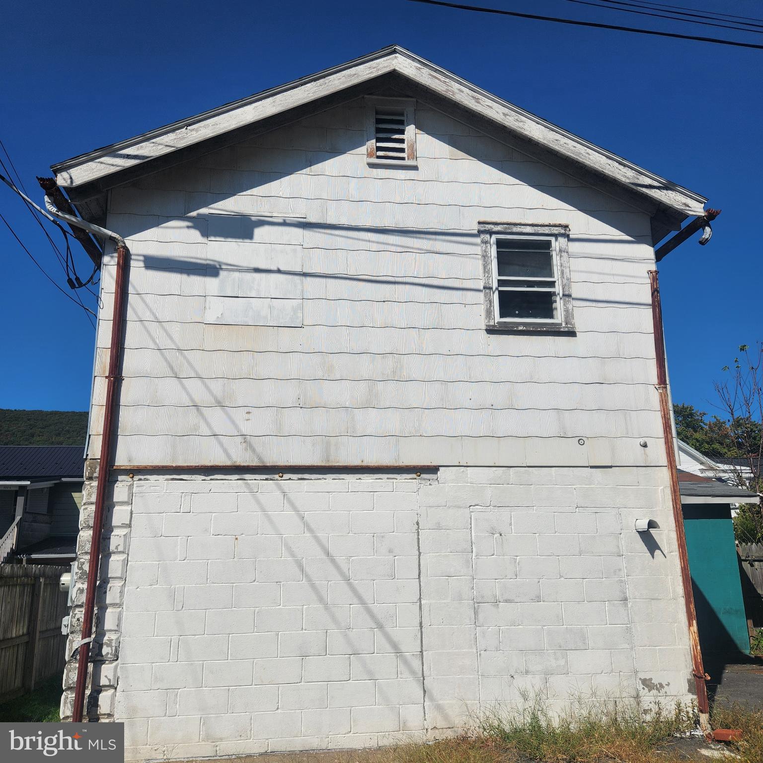526 North 2nd Street Lykens, PA 17048 - Photo 11 of 38 a view of a wooden house with a small yard