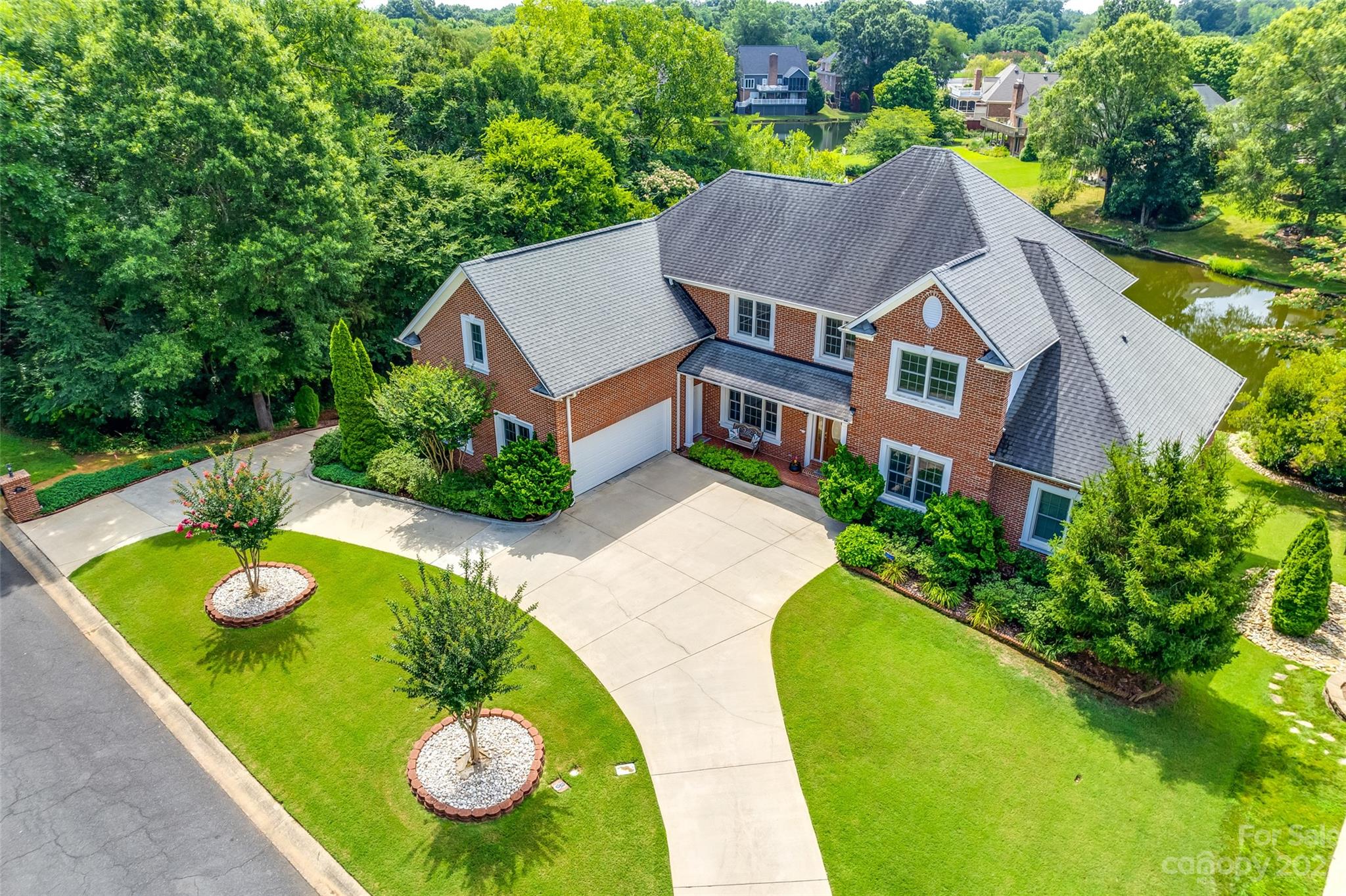 a aerial view of a house with swimming pool and big yard