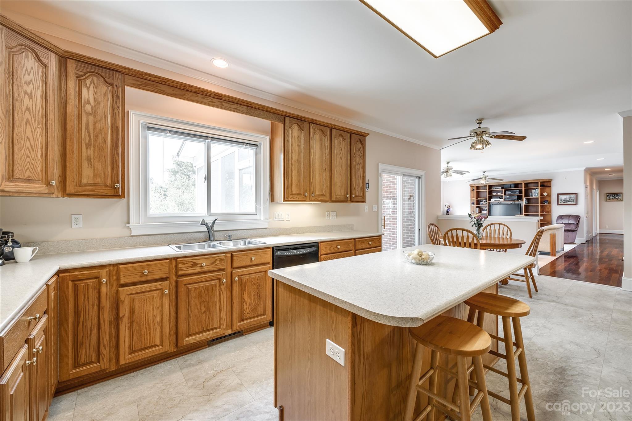 208 Chesterfield Canal Fort Mill, SC 29708 - Photo 14 of 48 a kitchen with a table chairs sink and cabinets