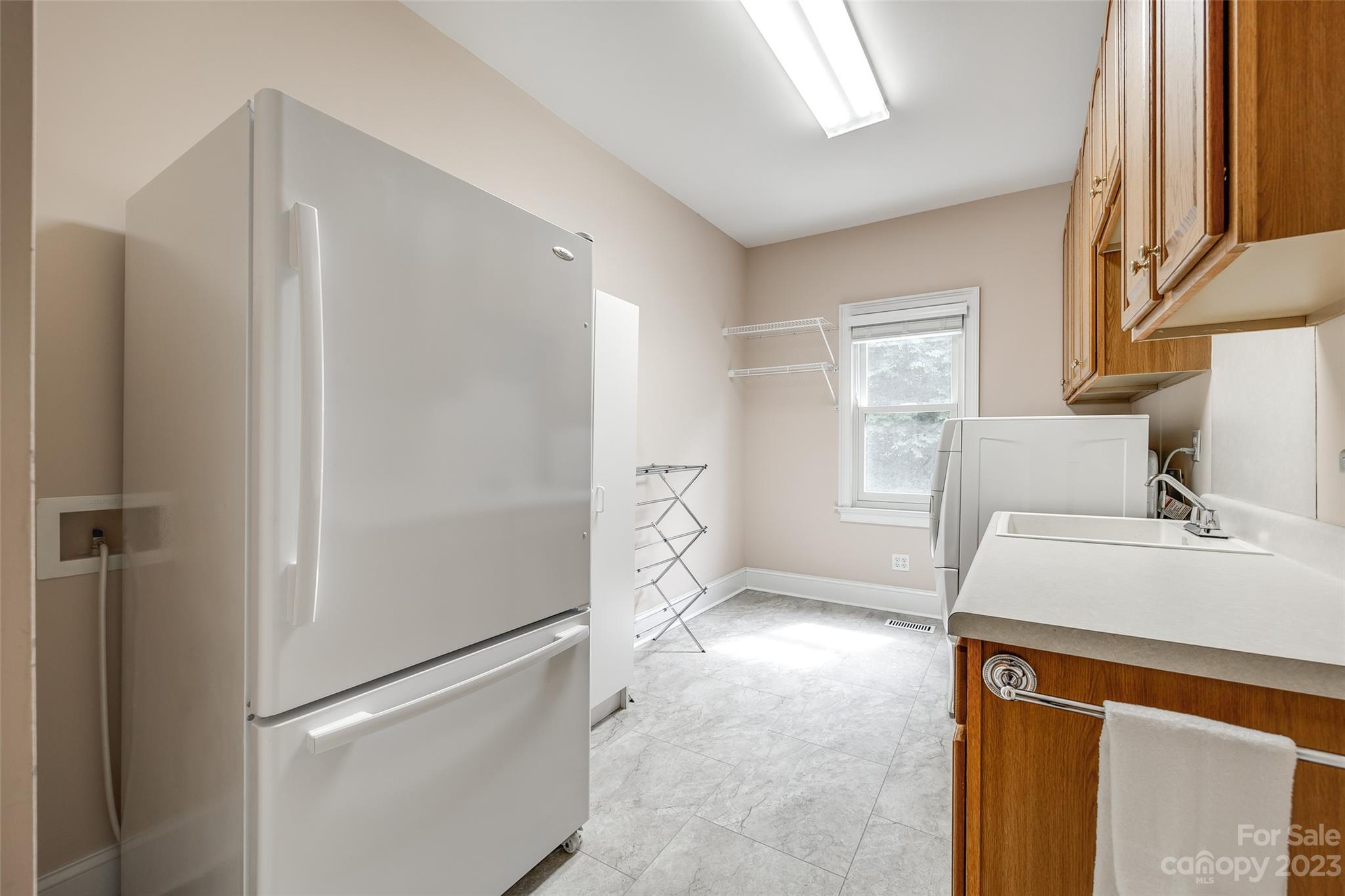 208 Chesterfield Canal Fort Mill, SC 29708 - Photo 15 of 48 a kitchen with a refrigerator and a sink