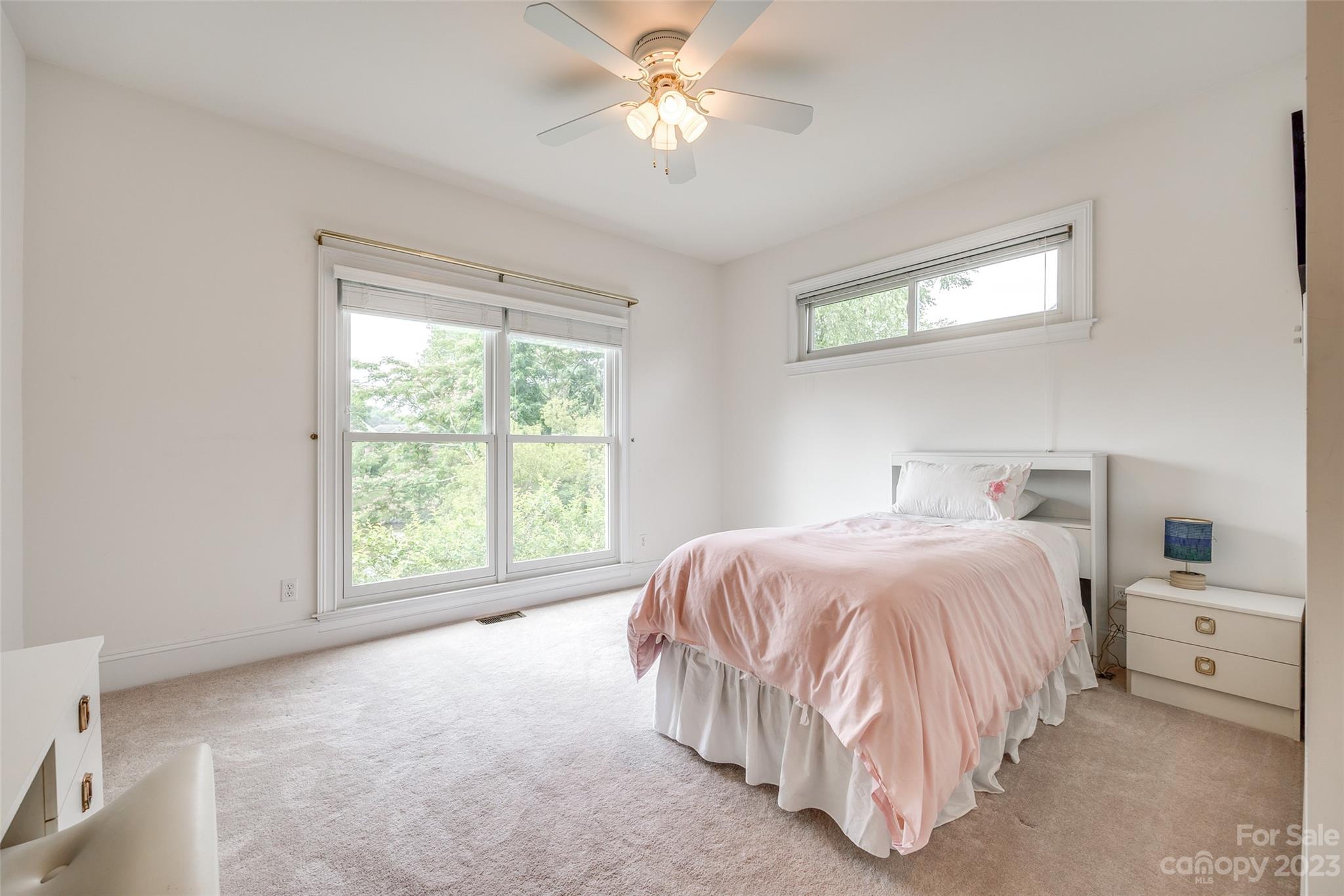208 Chesterfield Canal Fort Mill, SC 29708 - Photo 17 of 48 a bedroom with a bed and a chandelier