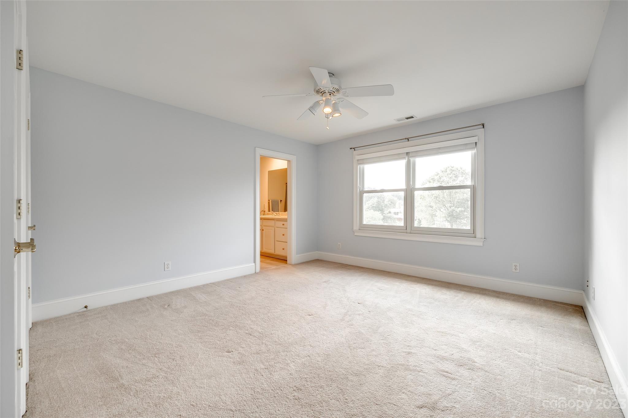 208 Chesterfield Canal Fort Mill, SC 29708 - Photo 21 of 48 an empty room with windows and ceiling fan view