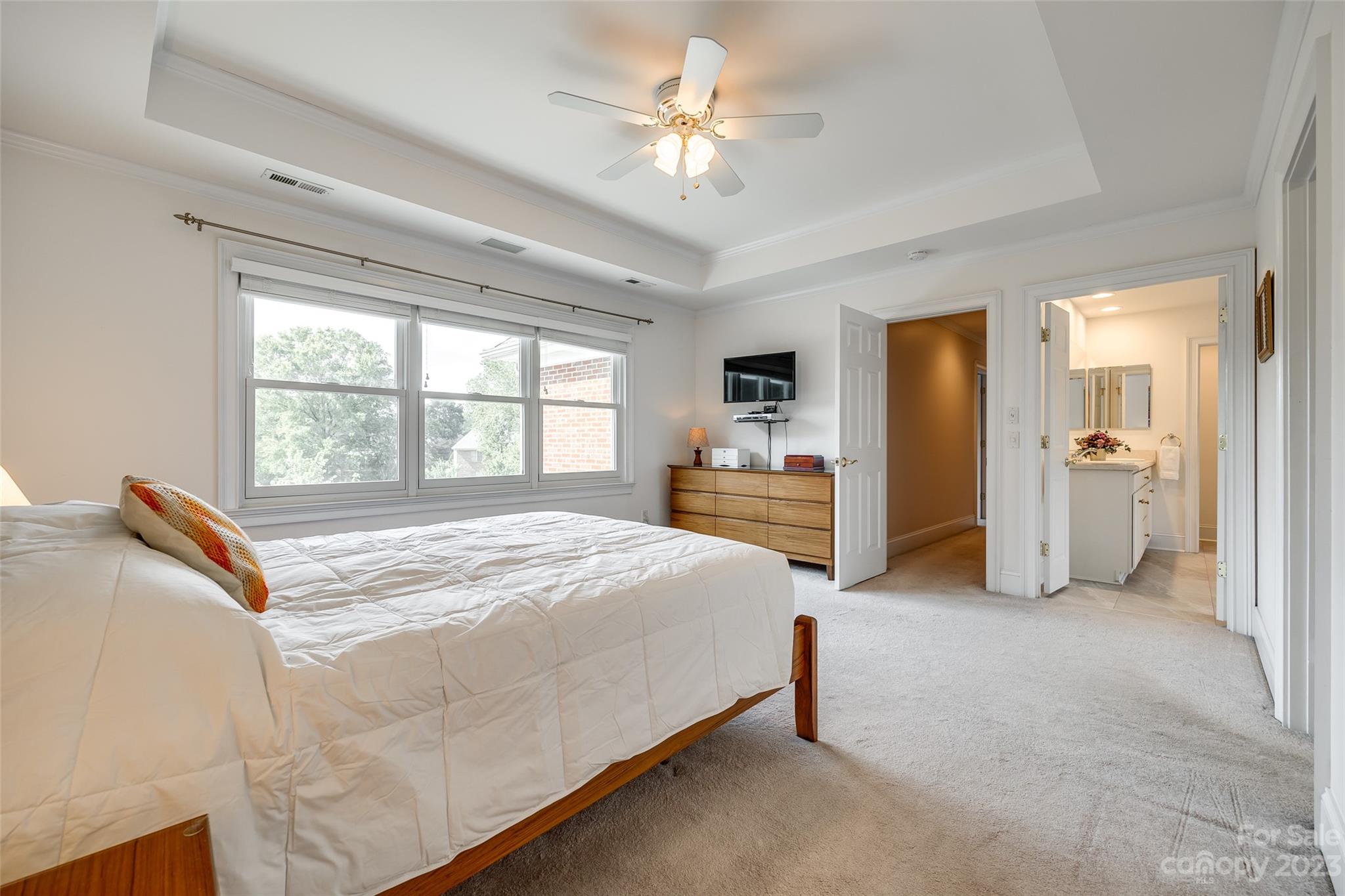 208 Chesterfield Canal Fort Mill, SC 29708 - Photo 26 of 48 a spacious bedroom with a bed and a chandelier