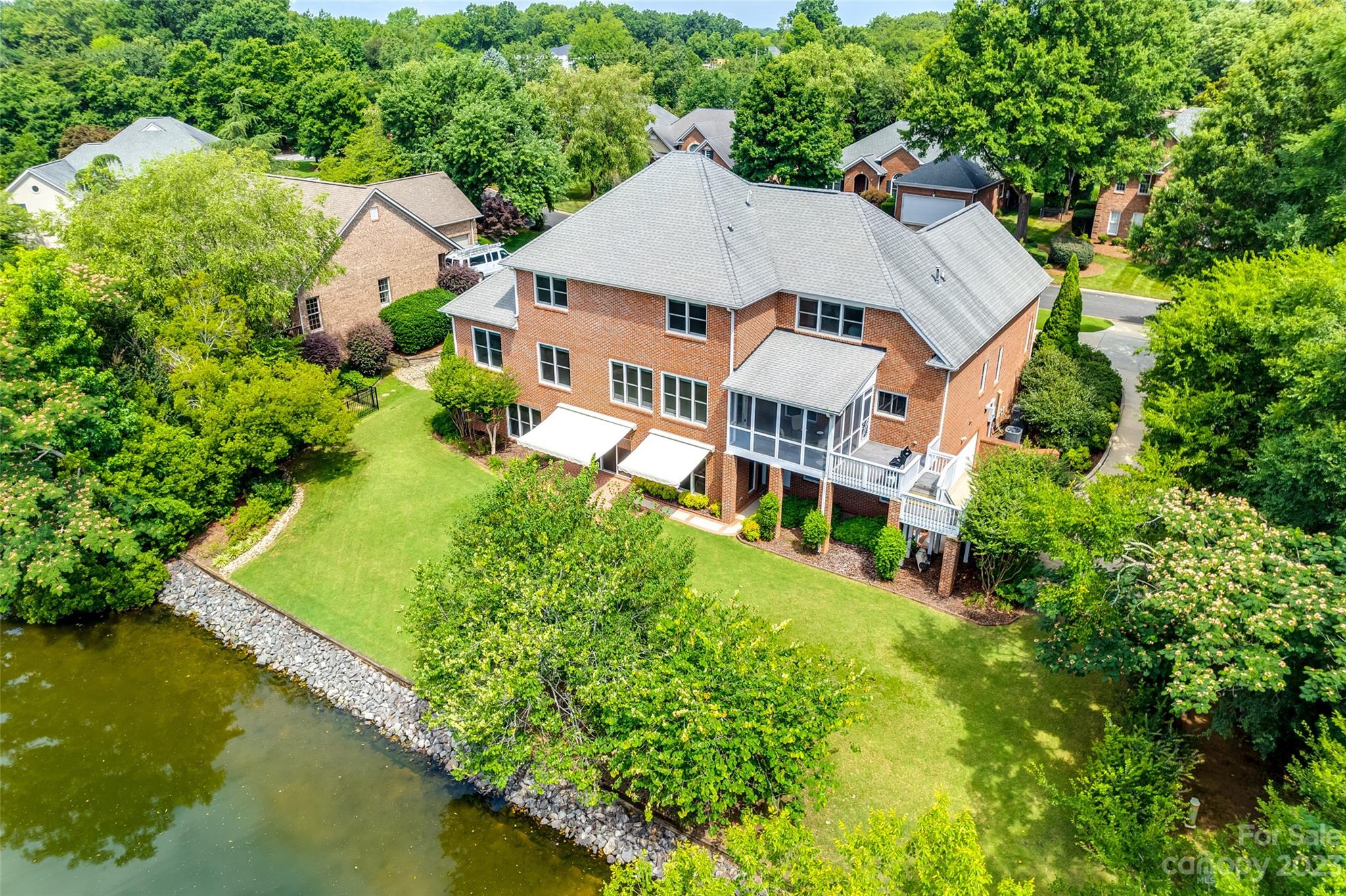 208 Chesterfield Canal Fort Mill, SC 29708 - Photo 3 of 48 an aerial view of house with swimming pool and garden