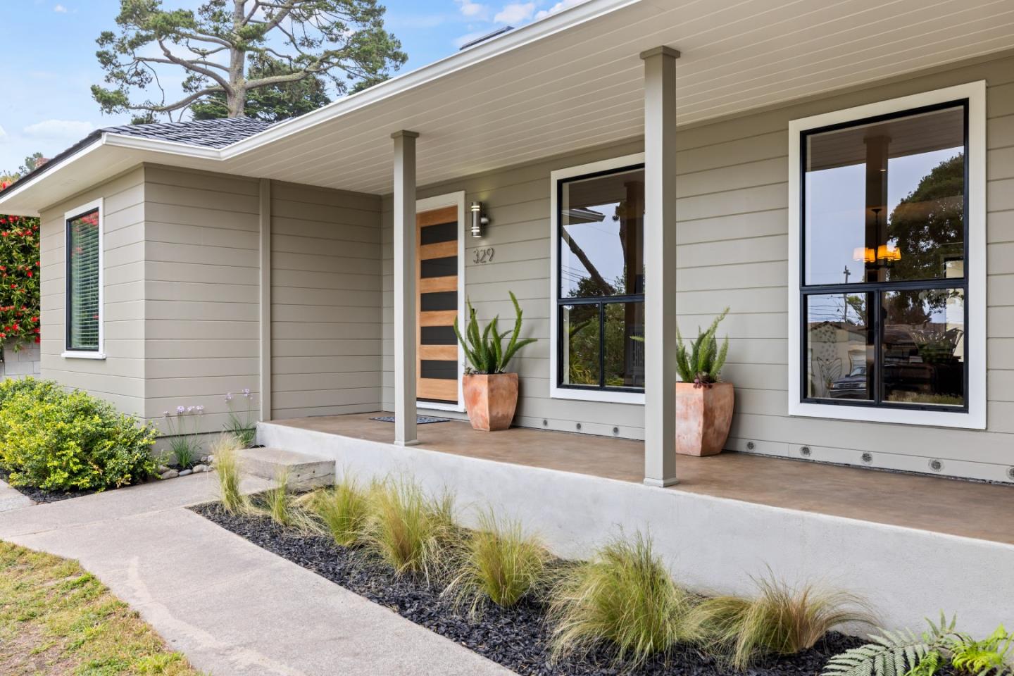 329 Stuart Avenue Pacific Grove, CA 93950 - Photo 1 of 21 a front view of a house with garden