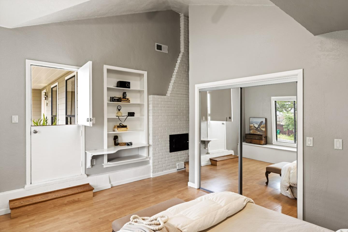 329 Stuart Avenue Pacific Grove, CA 93950 - Photo 16 of 21 a spacious bedroom with a bed and glass door