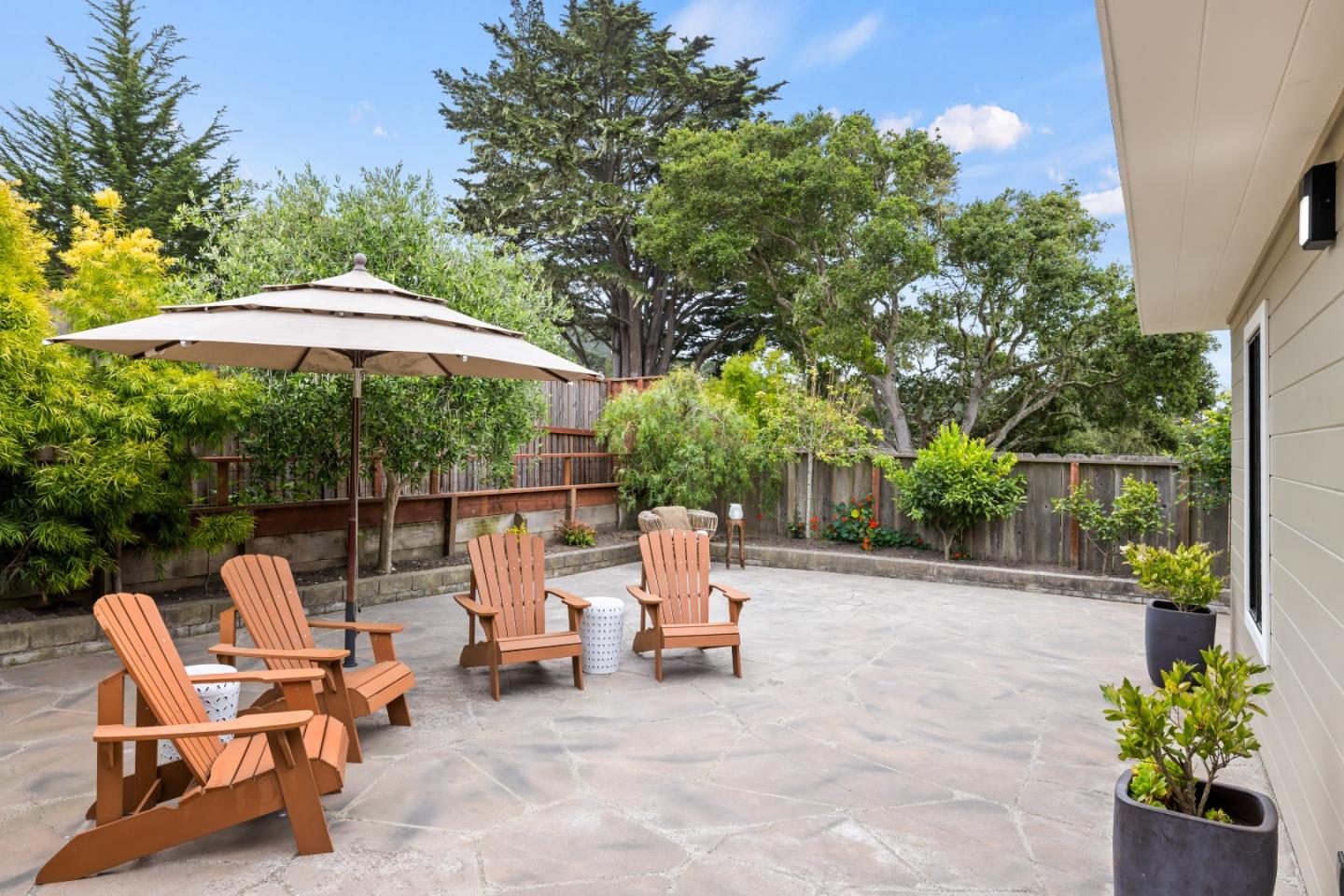 329 Stuart Avenue Pacific Grove, CA 93950 - Photo 20 of 21 a view of backyard with outdoor seating and trees