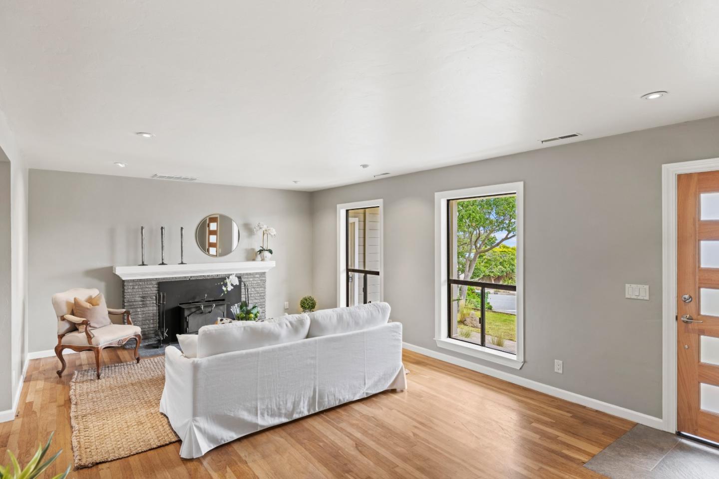 329 Stuart Avenue Pacific Grove, CA 93950 - Photo 4 of 21 a living room with furniture and a fireplace