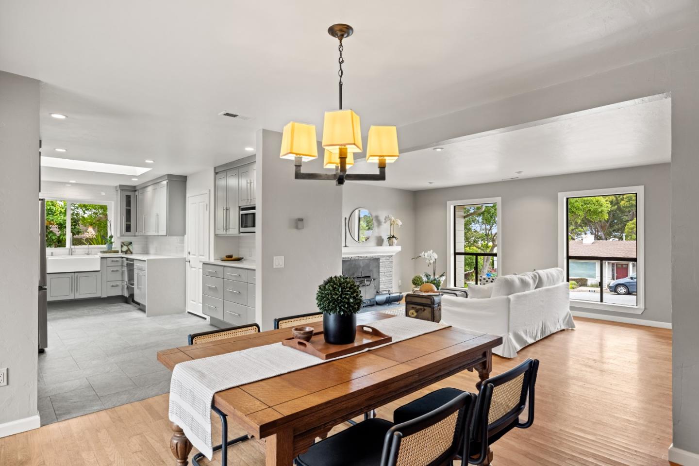 329 Stuart Avenue Pacific Grove, CA 93950 - Photo 6 of 21 a view of a dining room with furniture and wooden floor
