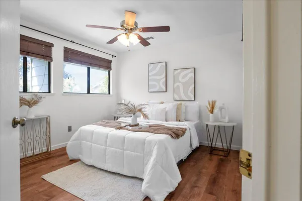 a bedroom with bed and window