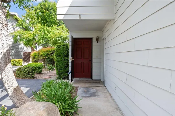 a entryway with flower pots