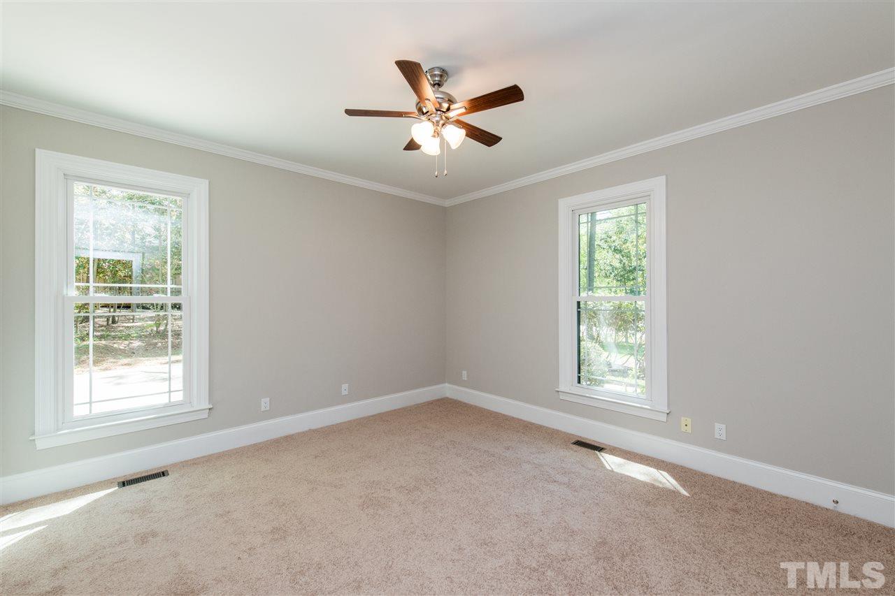 8804 Stage Ford Road Raleigh, NC 27615 - Photo 14 of 30 a view of an empty room with a window