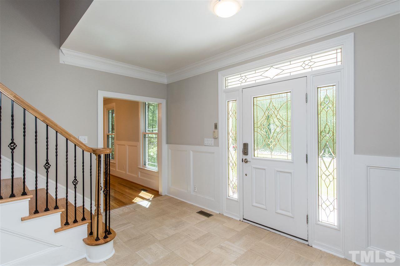 8804 Stage Ford Road Raleigh, NC 27615 - Photo 3 of 30 a view of a livingroom with entryway and stairs