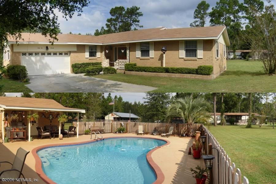 4170 Mustang Road Middleburg, FL 32068 - Photo 1 of 7 a view of a house with a swimming pool