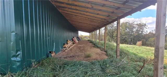 a view of a porch with wooden floor