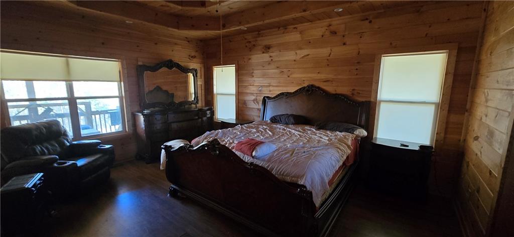 1350 Stivers Road Jasper, GA 30143 - Photo 64 of 70 a bedroom with a bed and wooden floor