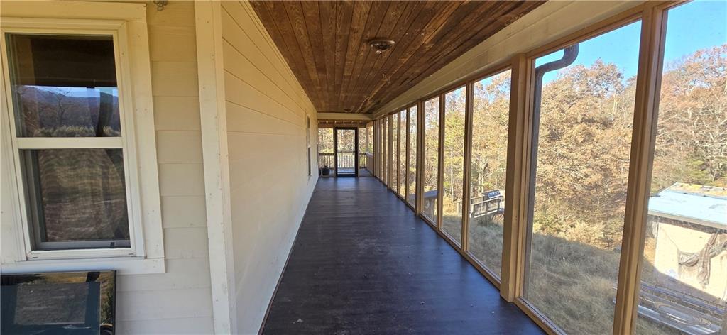 1350 Stivers Road Jasper, GA 30143 - Photo 67 of 70 a view of a hallway with wooden floor and stairs