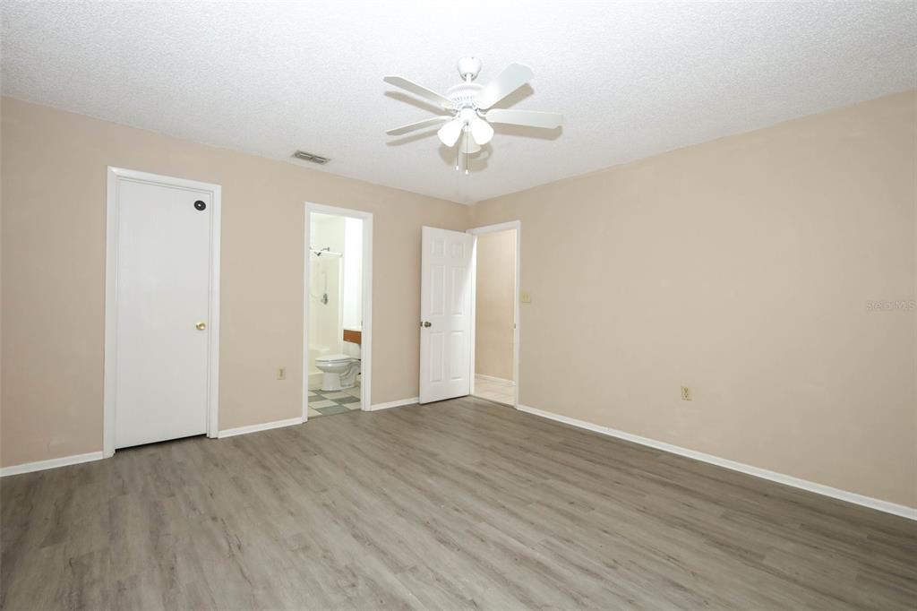 3240 Littlefield Street Deltona, FL 32738 - Photo 11 of 18 a view of an empty room with wooden floor