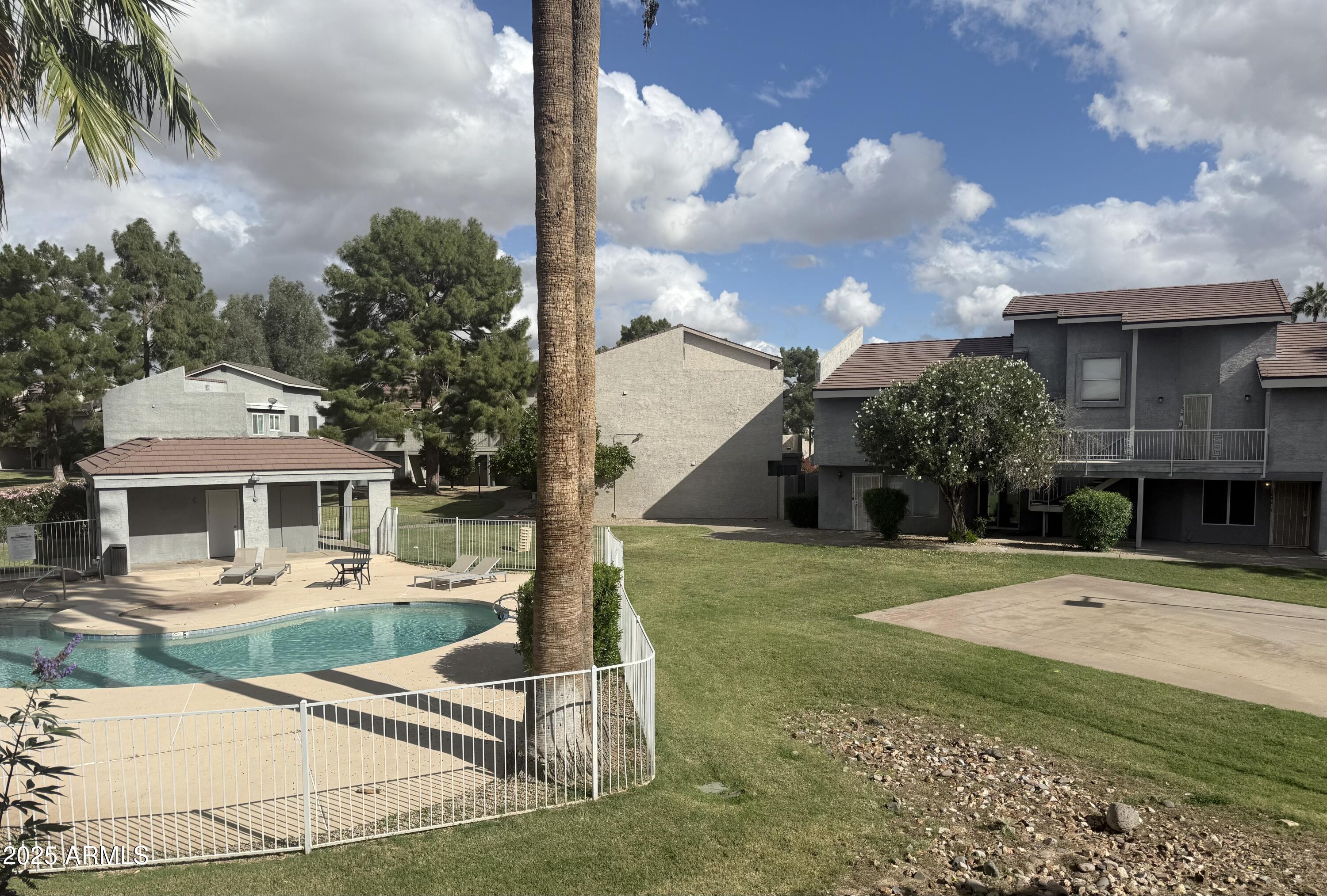 19601 North 7th Street, Unit 1030 Phoenix, AZ 85024 - Photo 1 of 19 a front view of a house with garden