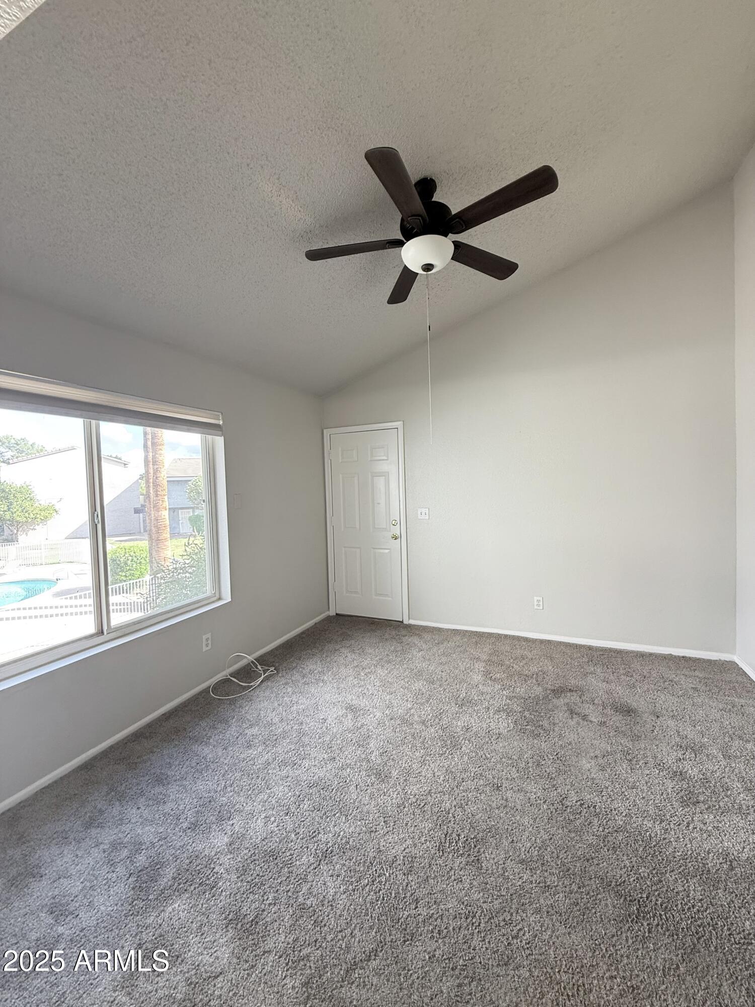 19601 North 7th Street, Unit 1030 Phoenix, AZ 85024 - Photo 11 of 19 an empty room with a window and a fan