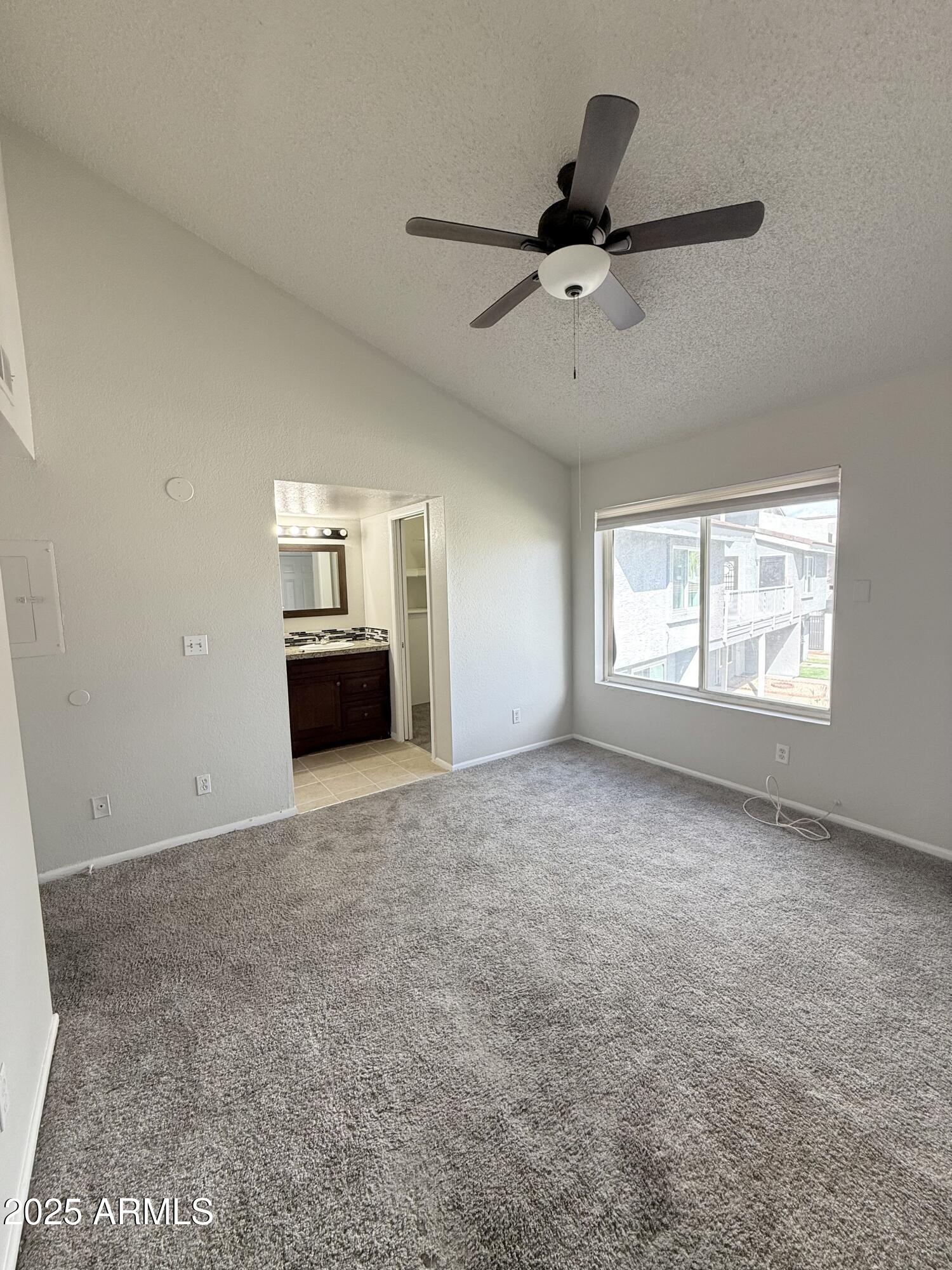 19601 North 7th Street, Unit 1030 Phoenix, AZ 85024 - Photo 12 of 19 a view of a livingroom with a ceiling fan and window