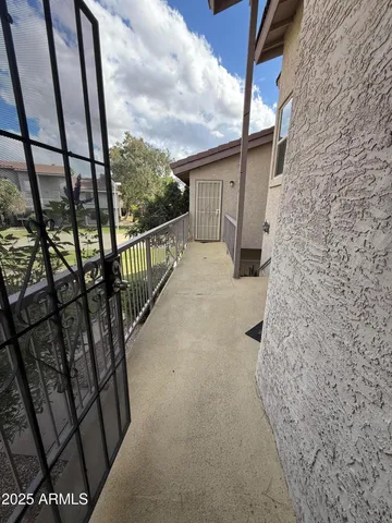 a view of balcony with wooden floor