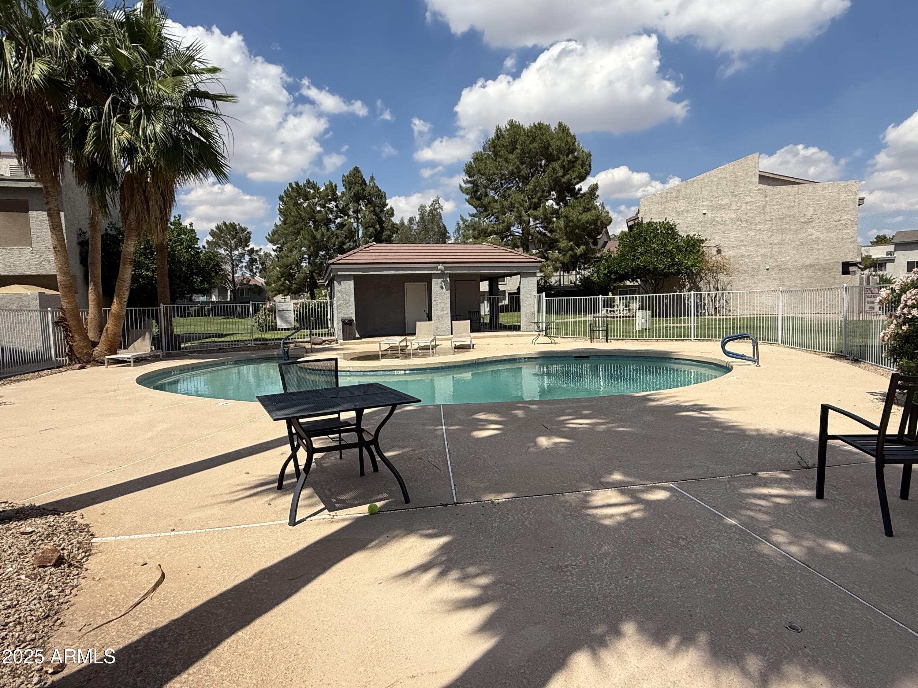 19601 North 7th Street, Unit 1030 Phoenix, AZ 85024 - Photo 17 of 19 a view of a patio with swimming pool