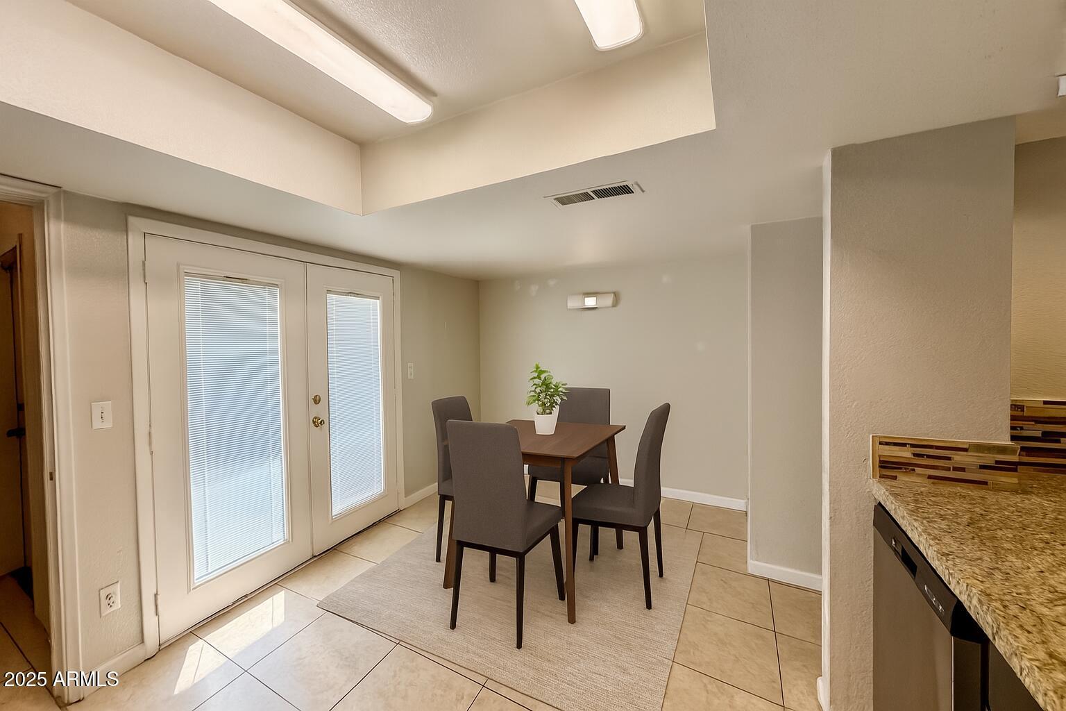 19601 North 7th Street, Unit 1030 Phoenix, AZ 85024 - Photo 6 of 19 a view of a dining room with furniture and chandelier