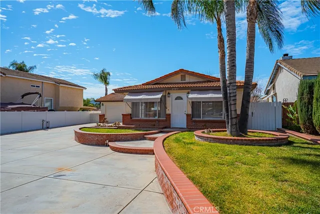 a view of a patio with couches and a fire pit